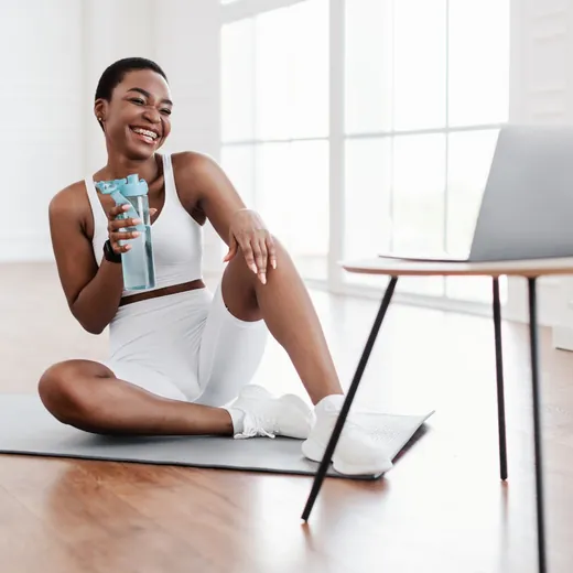 A fitness participant following an online workout